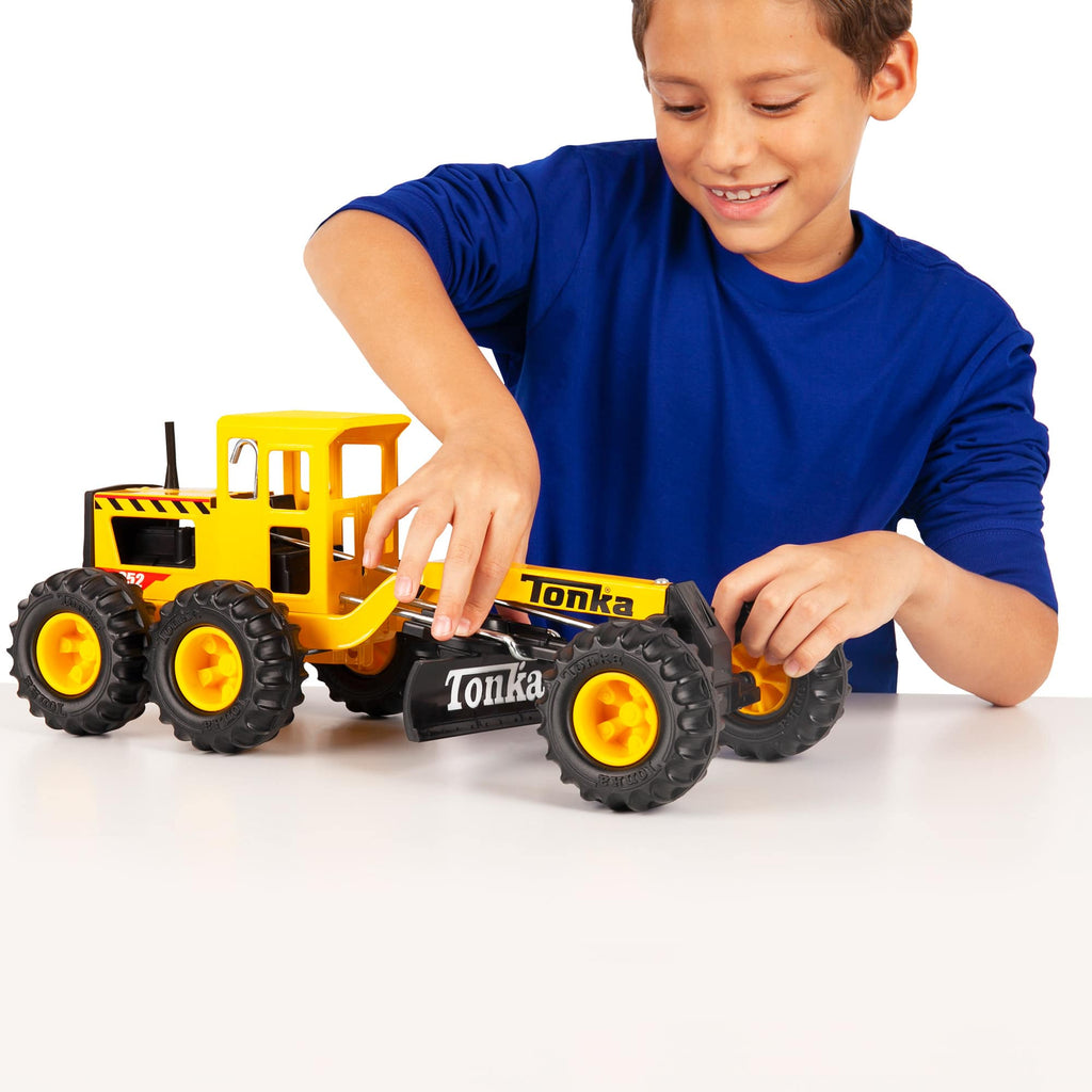 Tonka Road Grader - Lifestyle shot with a boy playing with the Road Grader